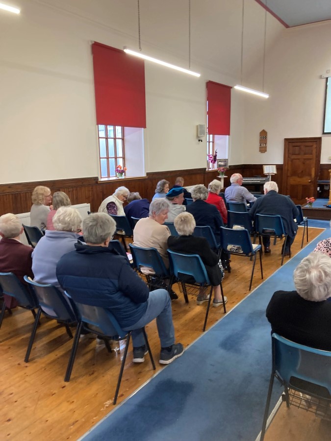 Reading from the Bible at the Portknockie Church of Christ